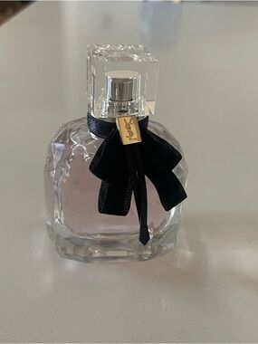 Yves Saint Laurent Pink Fragrance Bottle with Black Bow and Gold Charm. 1.6oz
